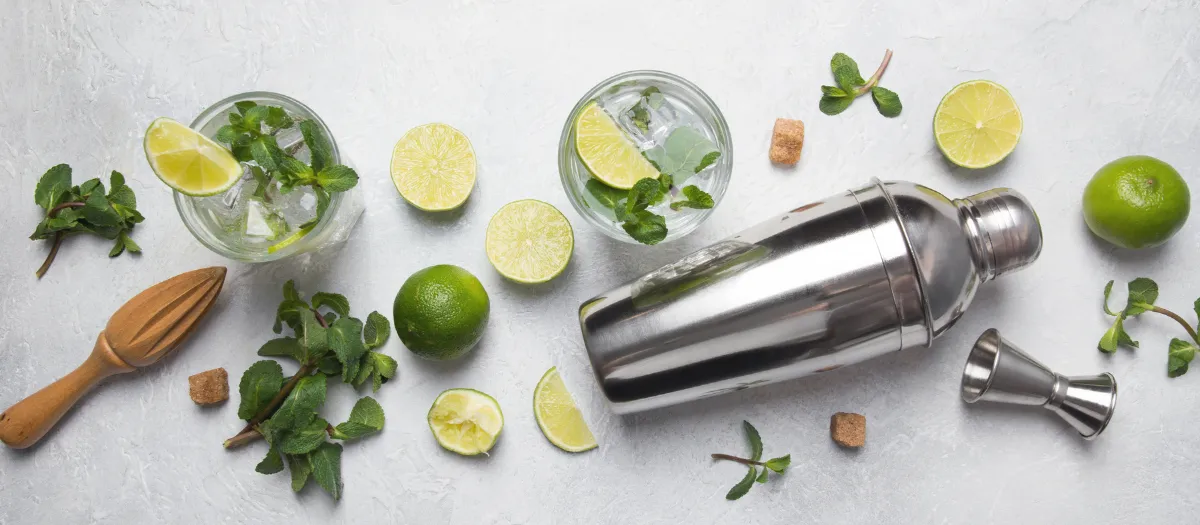 Cocktail glasses, citrus, mint and a shaker, from Geaux Sip's package page